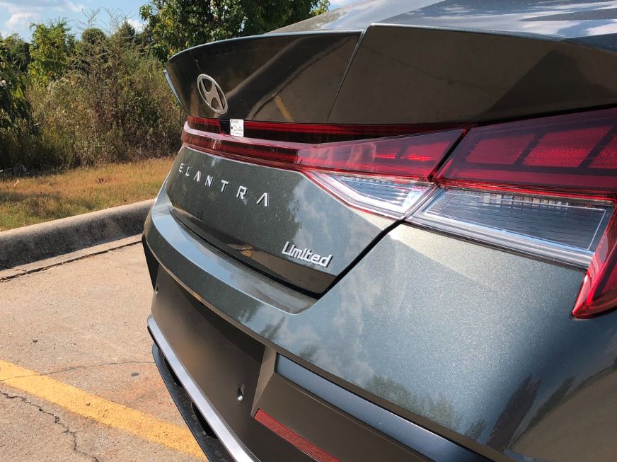 Close-up of the rear badge and taillight of a Hyundai Elantra Limited trim parked at Crain Hyundai of Fayetteville.